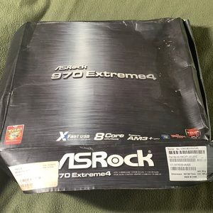 AS Rock 970 Extreme4 mother board.  All parts sealed.  Water damaged box.